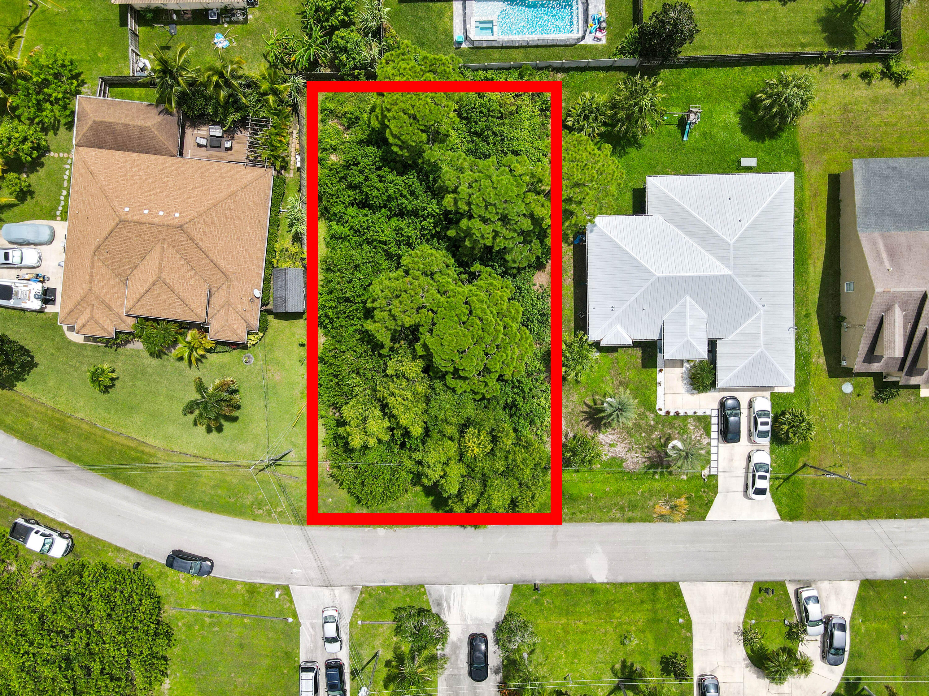 an aerial view of a house with a yard and garden