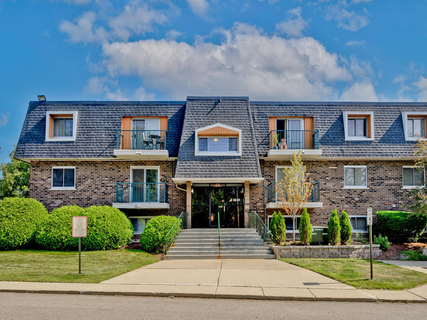 a front view of building with yard