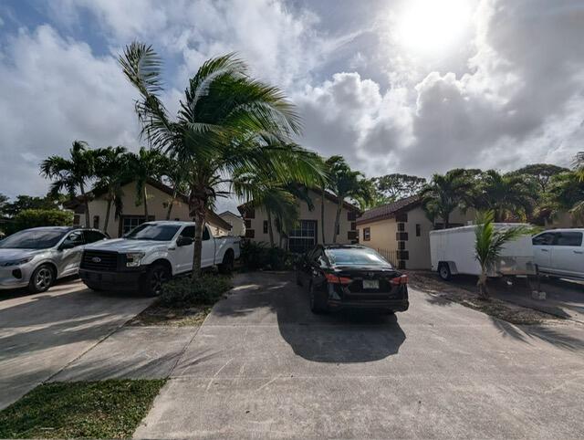 a view of a car parked in front of a house