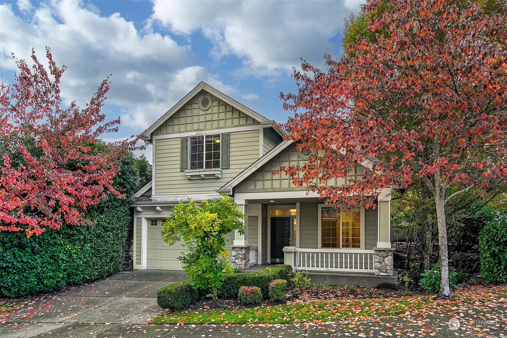 a front view of a house with garden