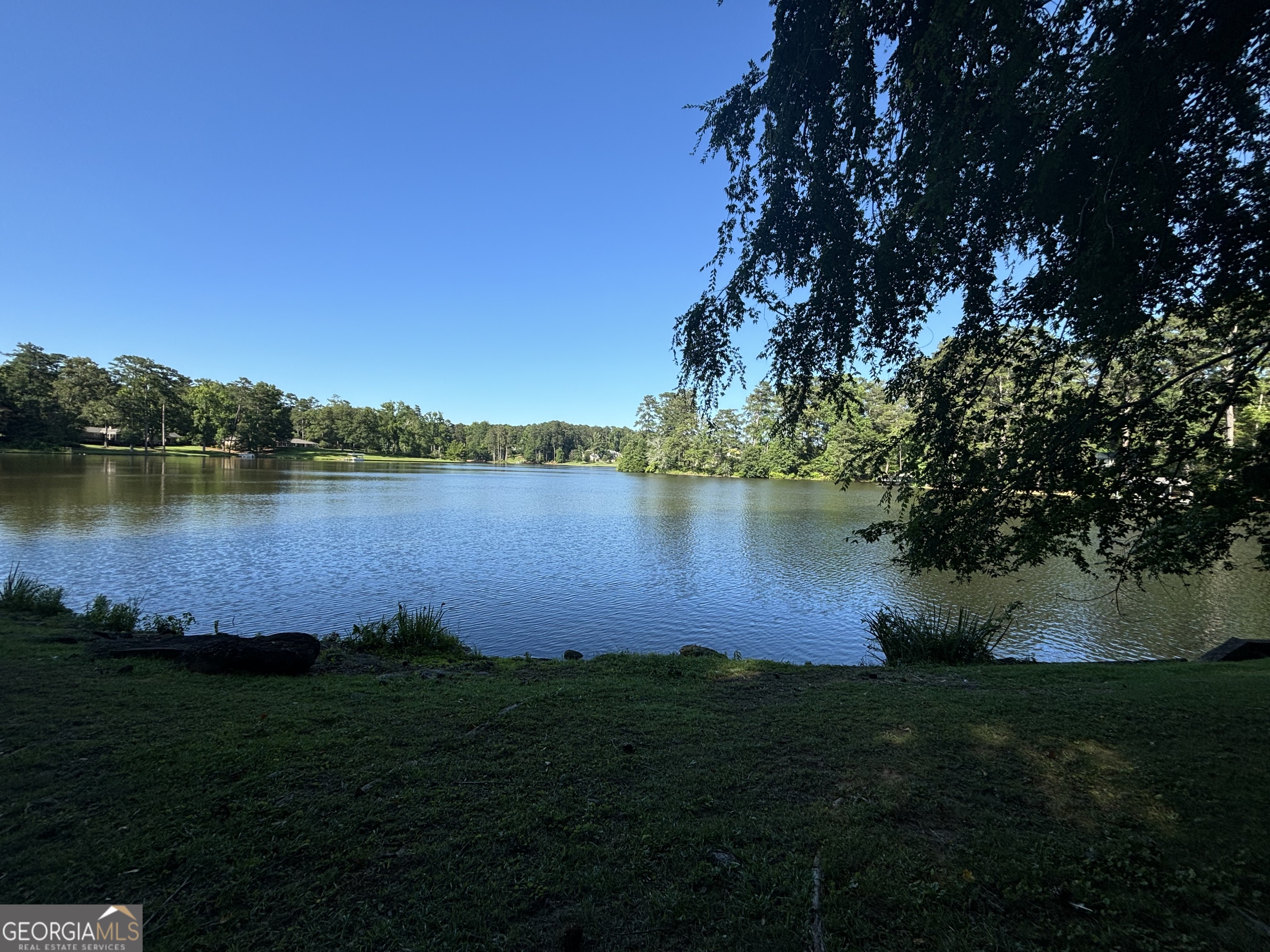 a view of a lake with a big yard