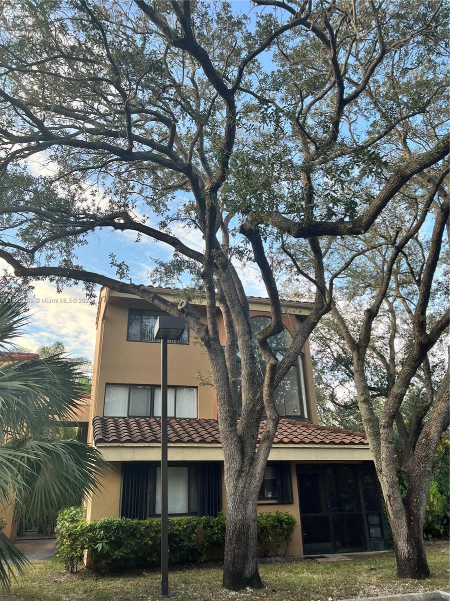 a view of house with yard