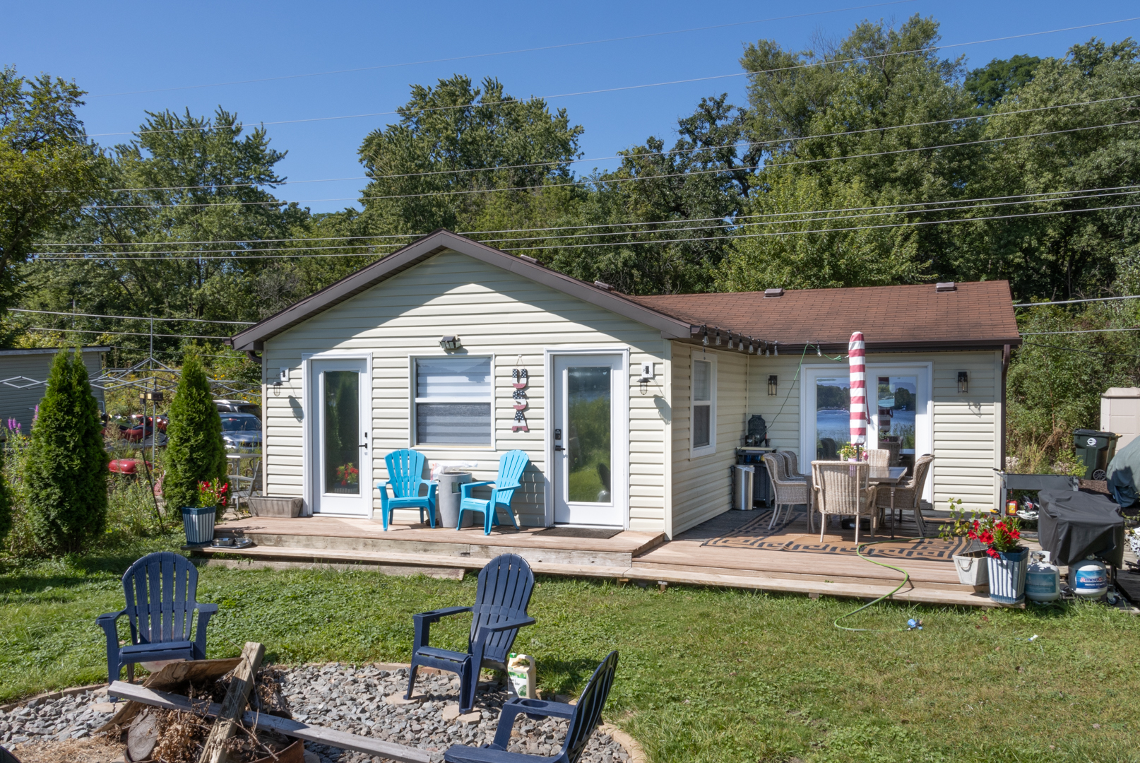 a view of a house with backyard sitting area and garden