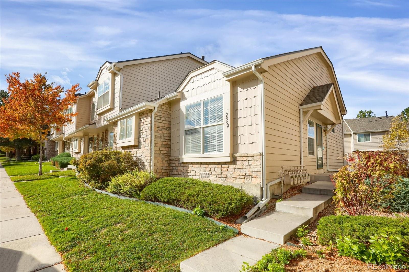 a view of a house with a yard