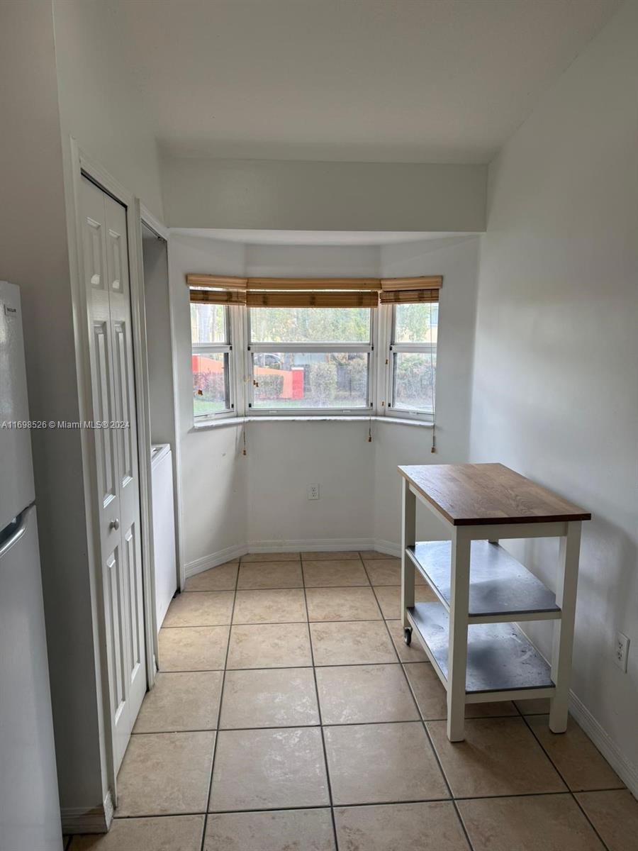 a view of kitchen with furniture and window