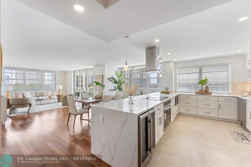 a large white kitchen with lots of counter top space