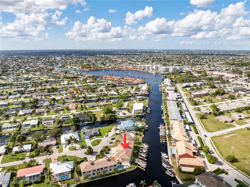 an aerial view of residential building and car parked