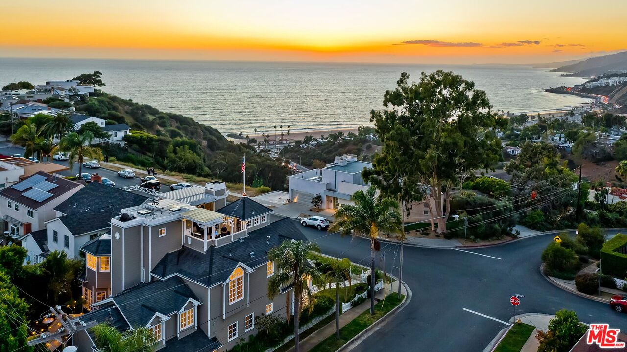 an aerial view of houses with yard