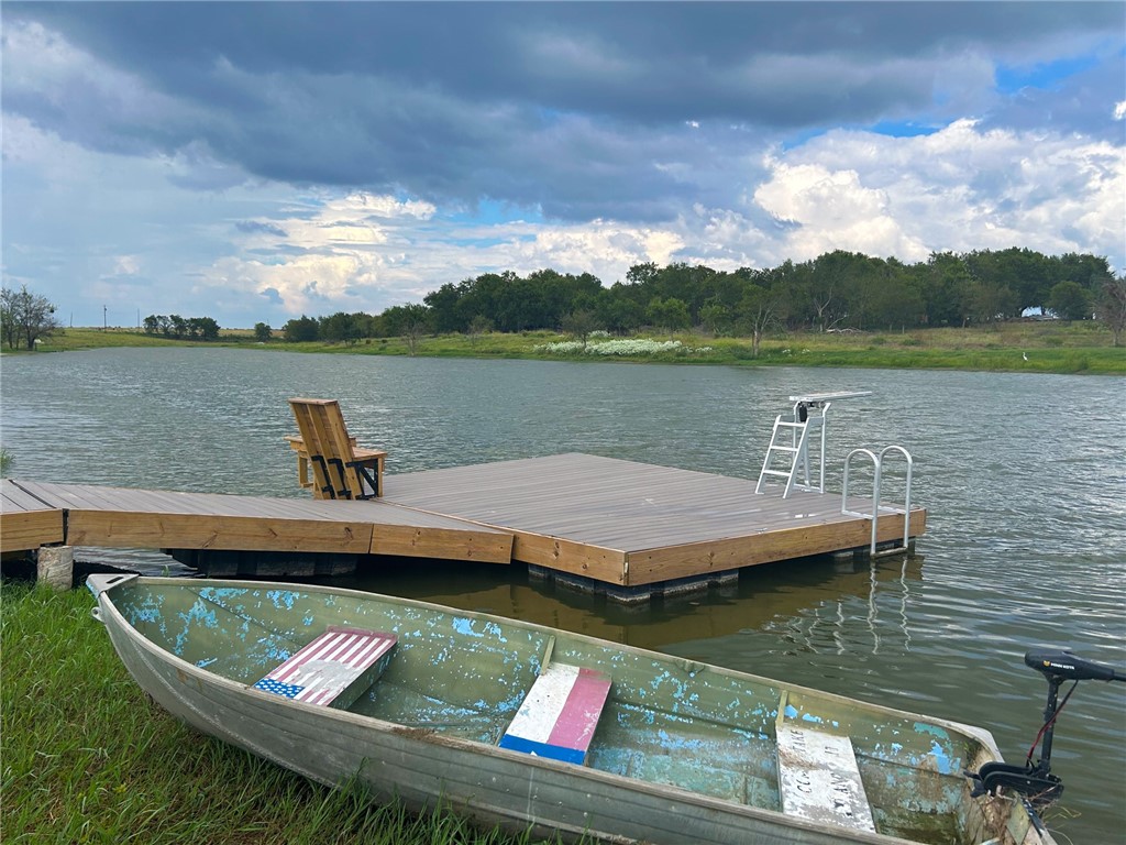 a view of a lake with houses in the background