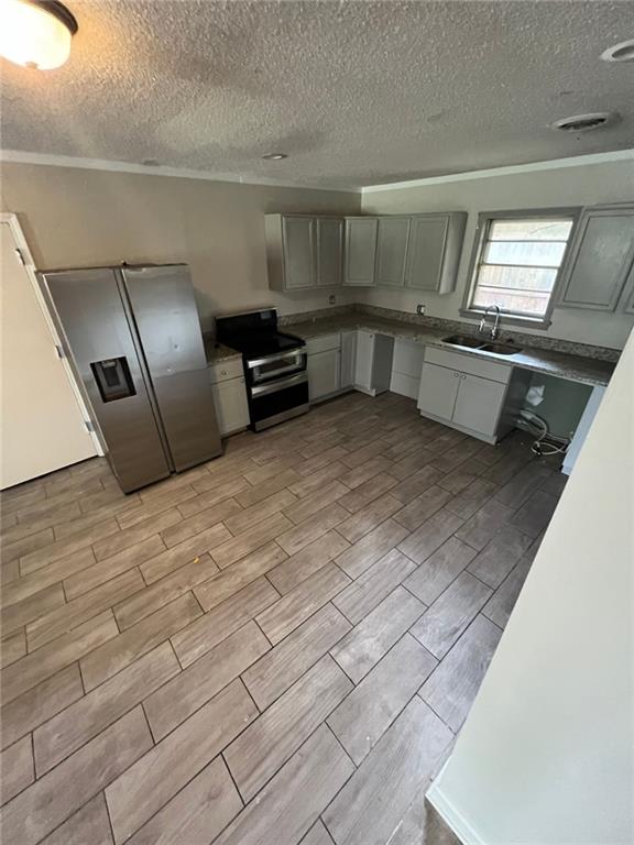 a view of a kitchen with a sink