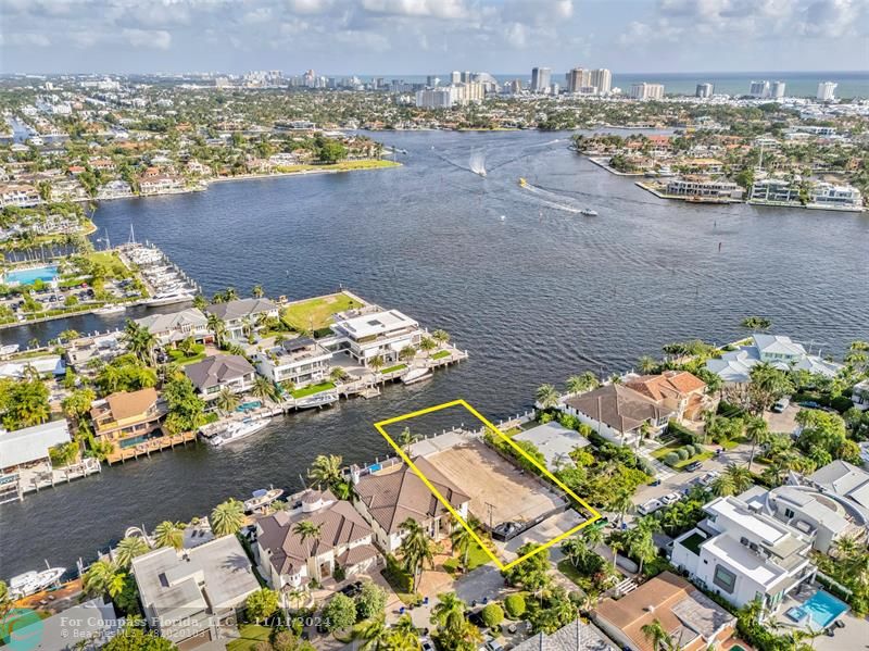 an aerial view of a house with a lake view