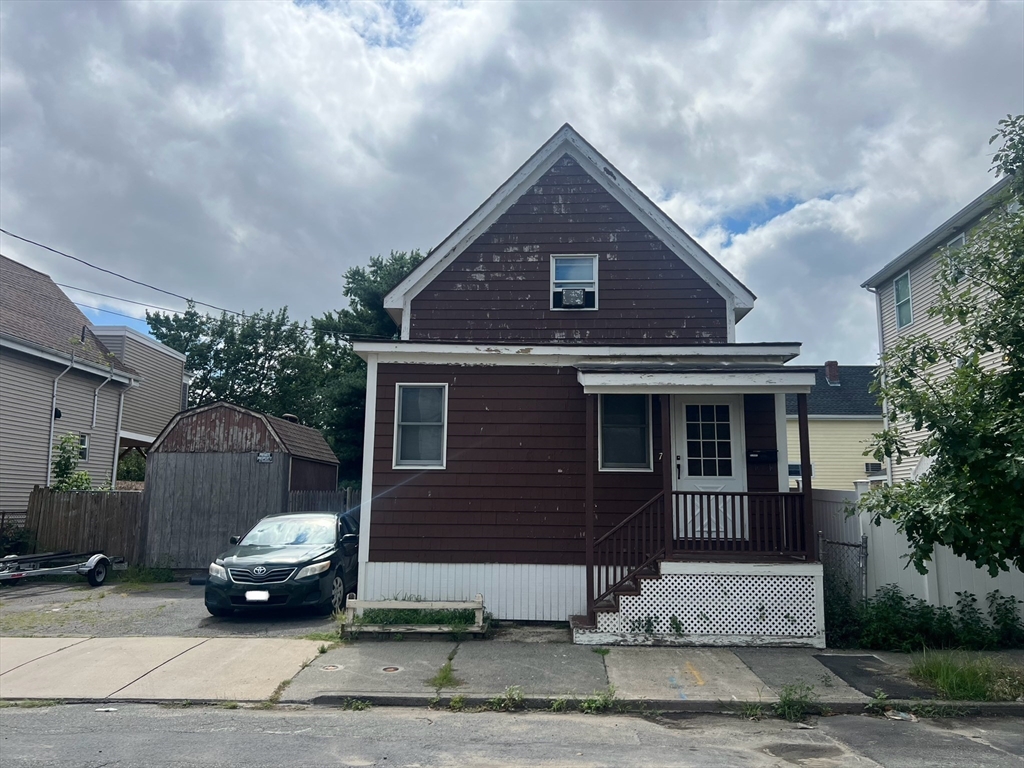 a car parked in front of a house