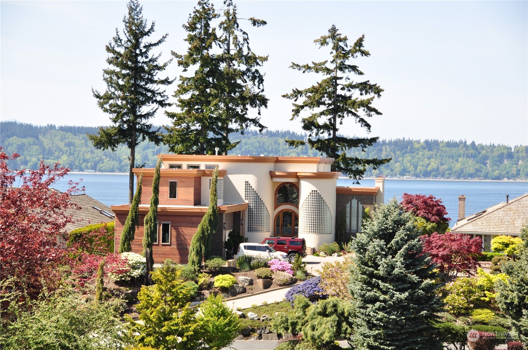 an aerial view of a house with a yard and fountain