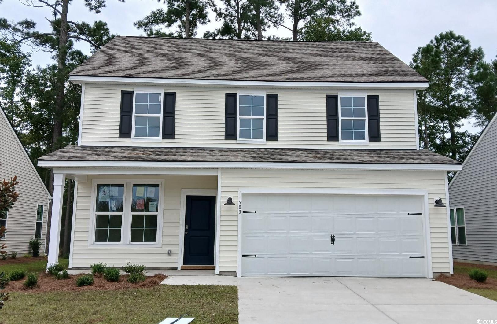 View of front facade with a garage