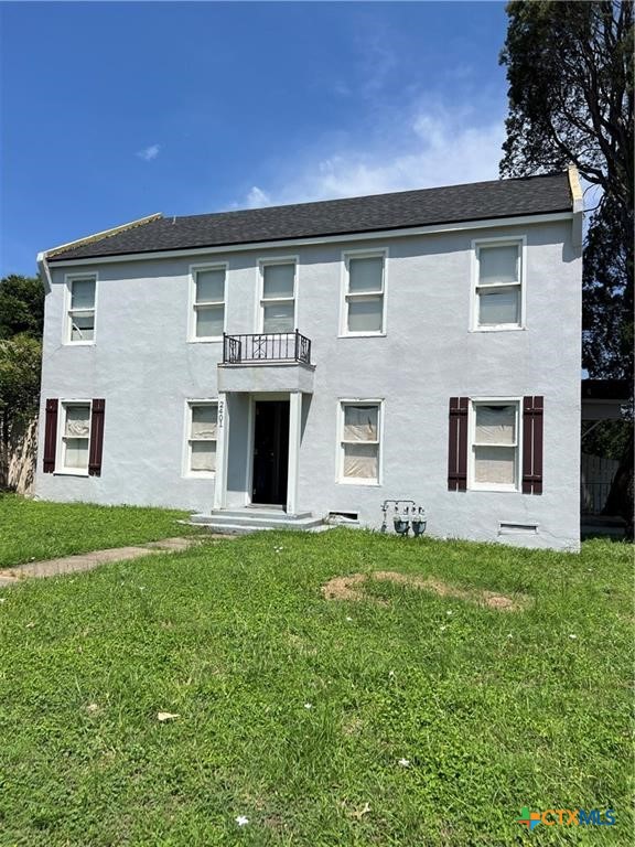 front view of a house with a yard