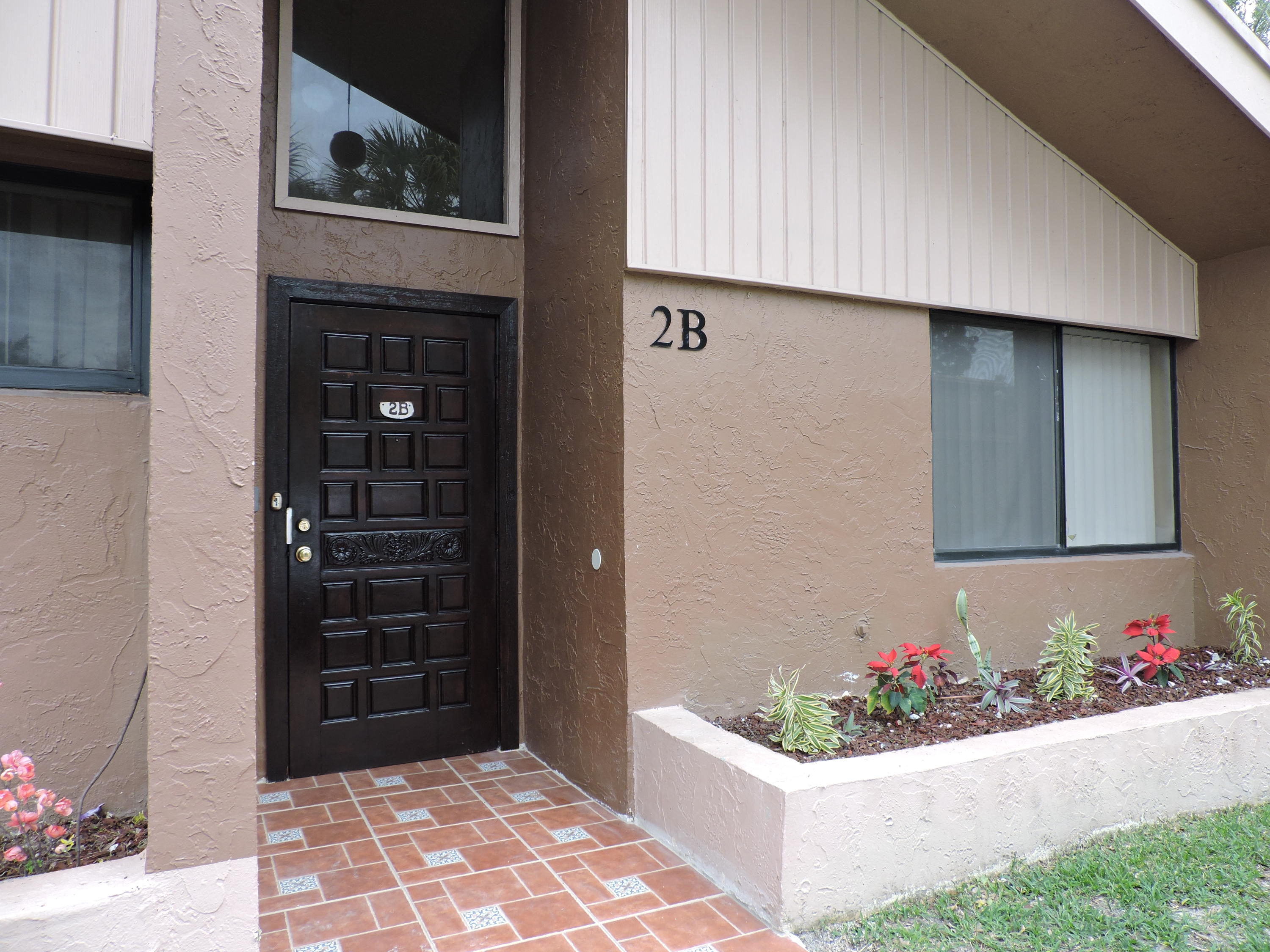 a view of front door and wooden floor