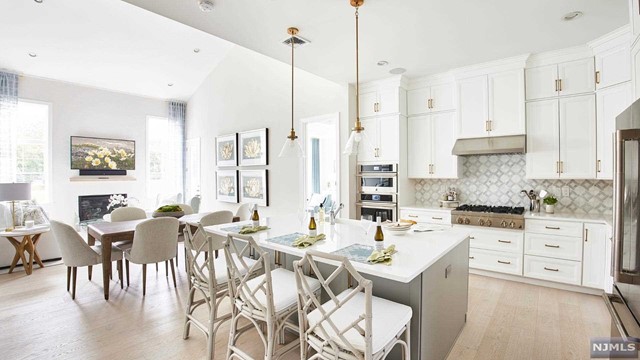 a large kitchen with lots of counter space and living room