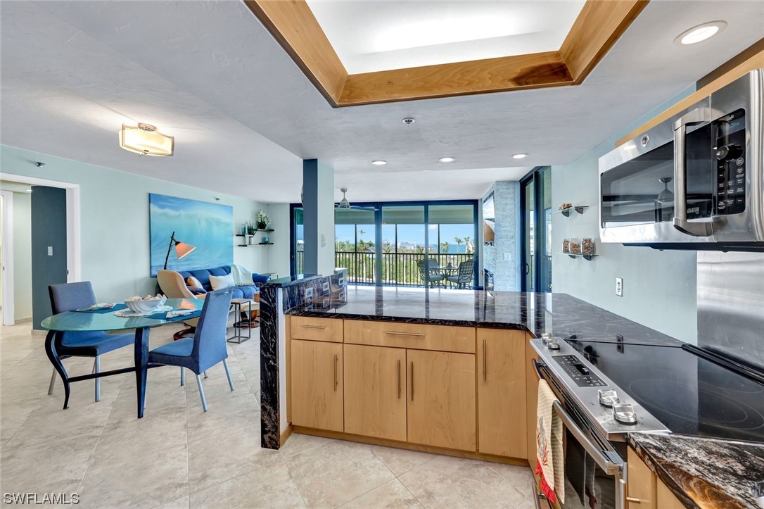 a view of a kitchen and dining room