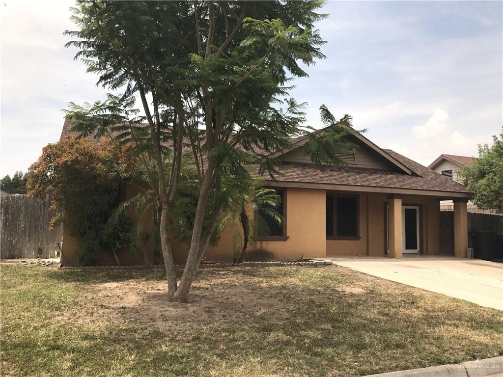 View of front of property featuring a front yard and a patio area