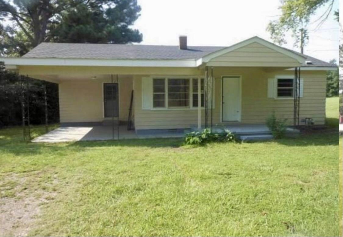 front view of a house with a yard