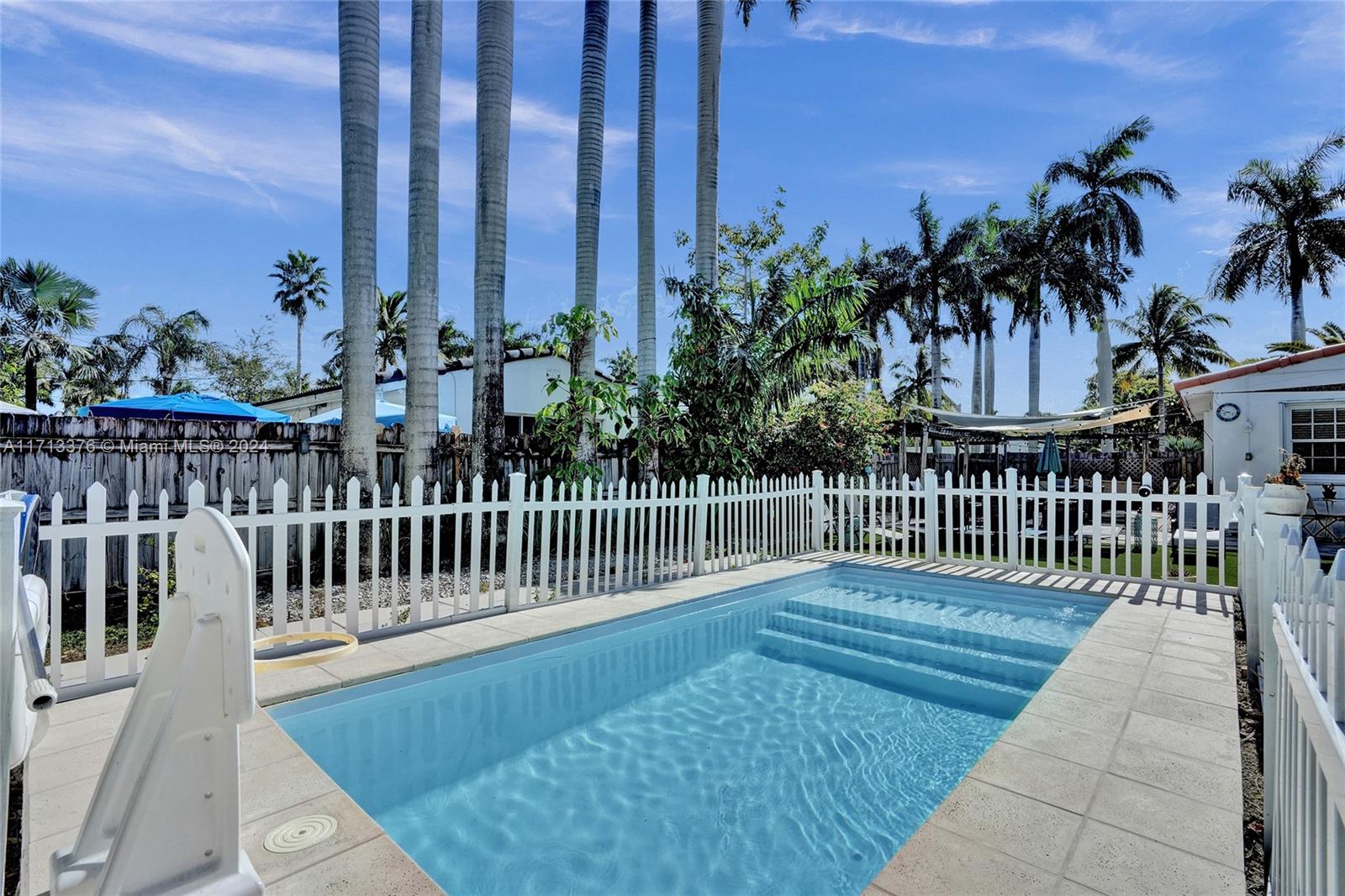 a view of a roof deck with wooden fence