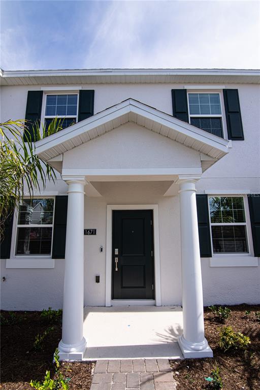 a front view of a house with garage