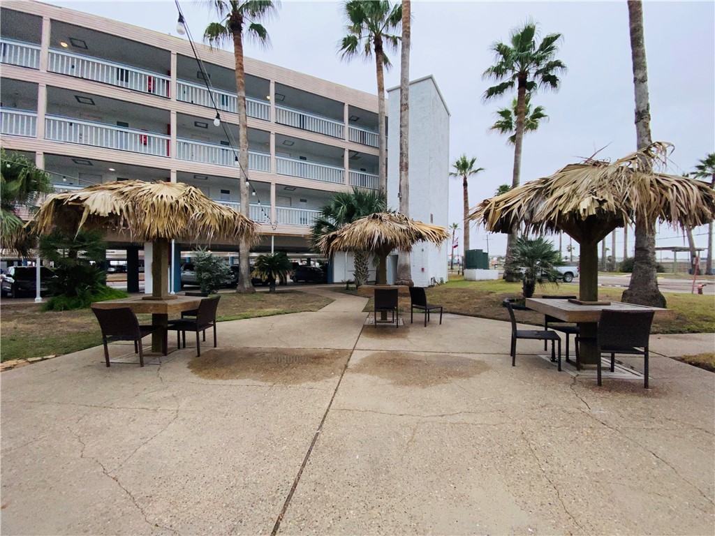 a view of a patio with a table and chairs