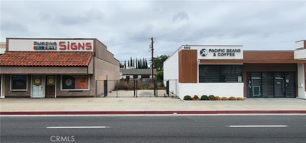 a view of a building with car parked