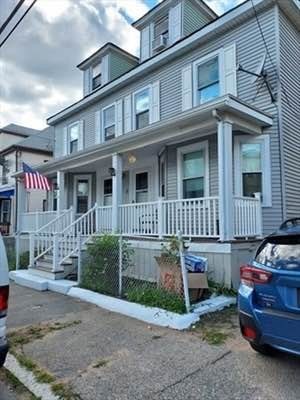 a front view of a house with parking space