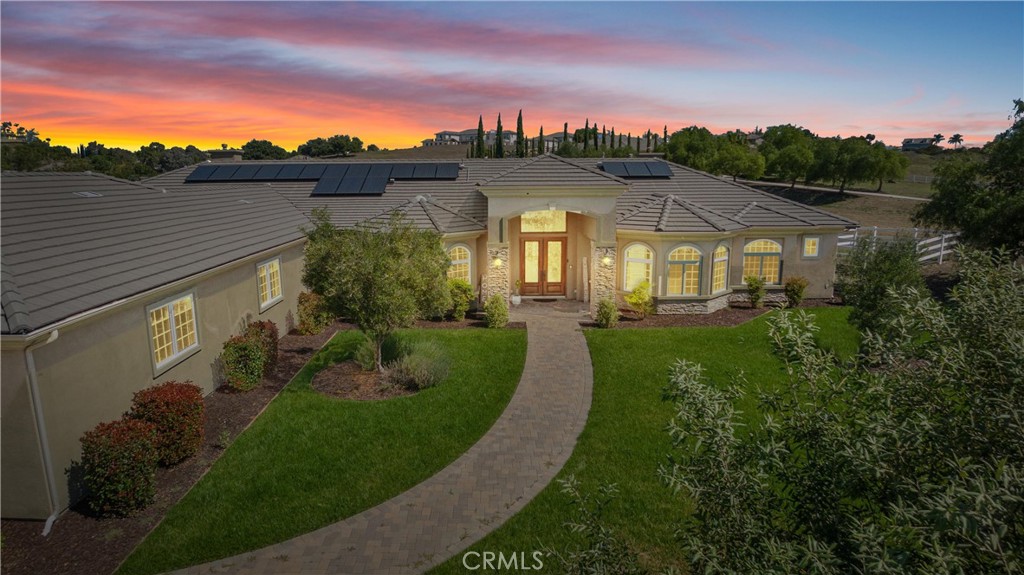 a view of a big yard in front of a house