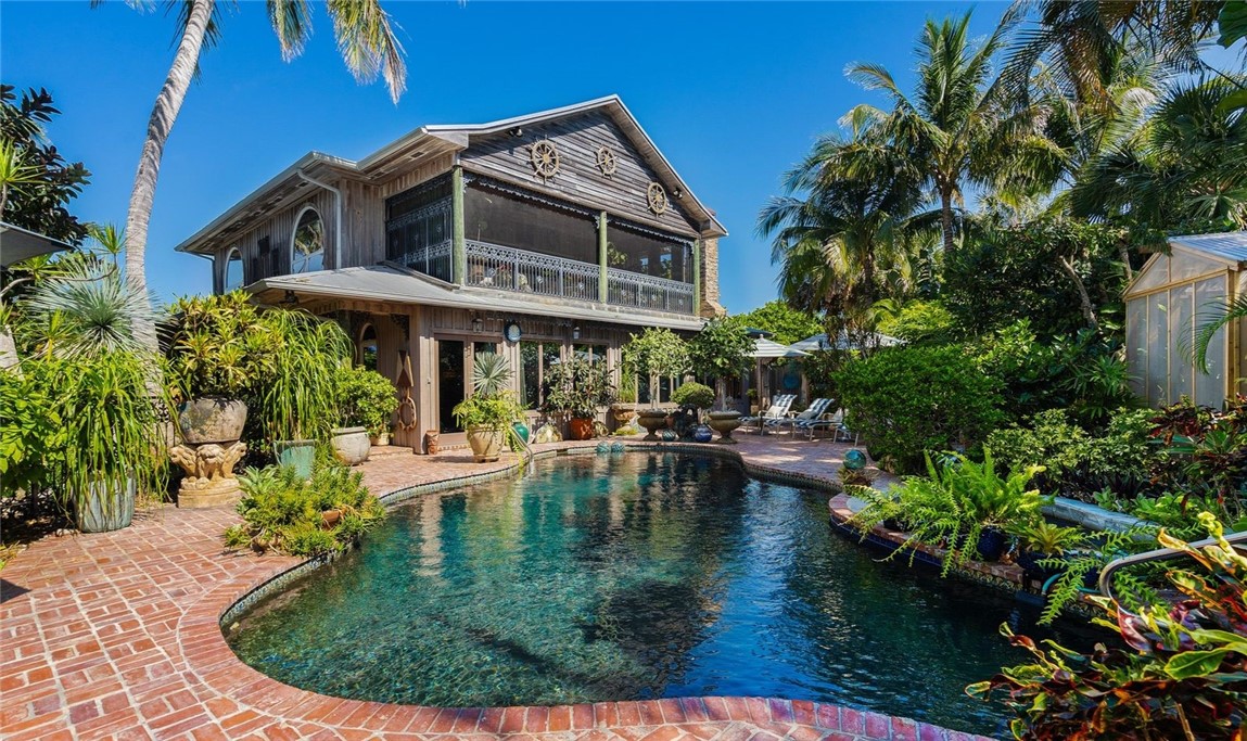 a view of a swimming pool with sitting area