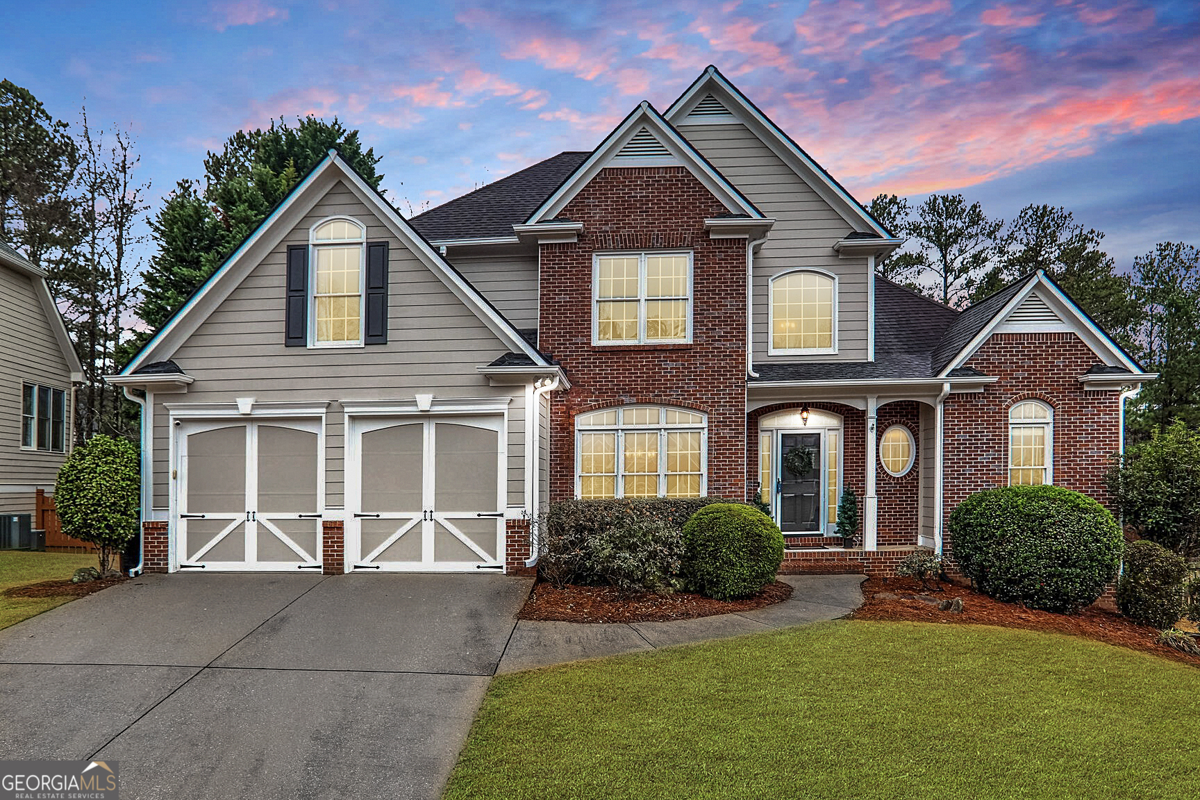 a front view of a house with a yard