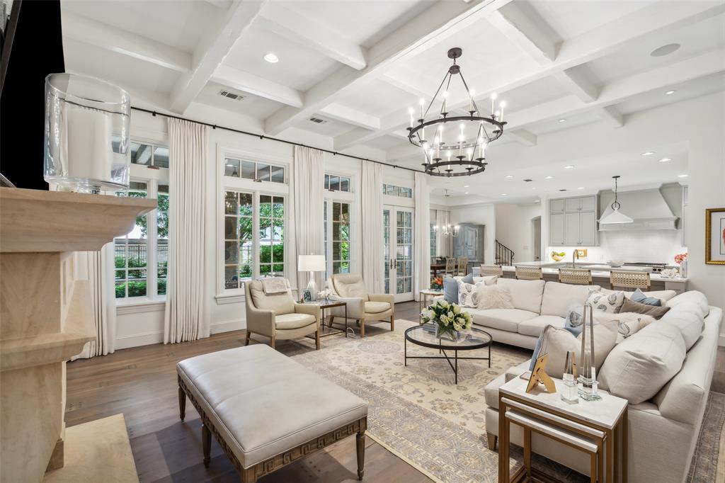 a living room with furniture a chandelier and a chandelier