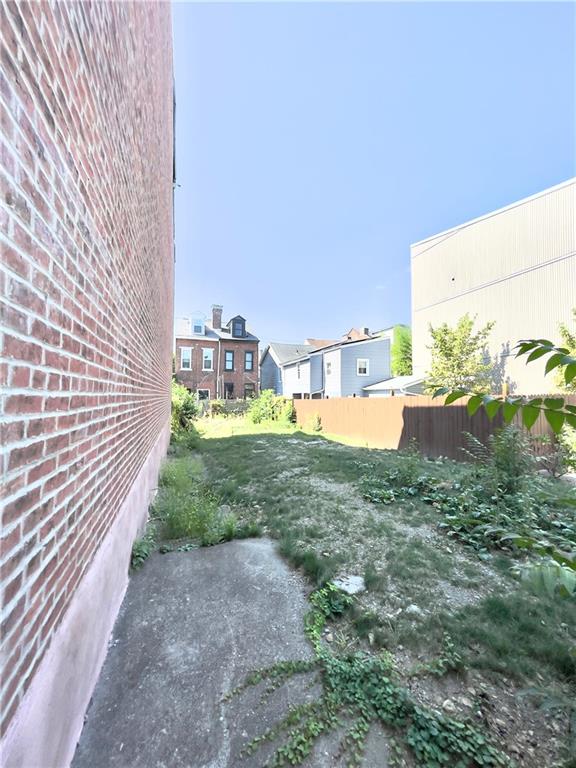 a view of a yard with an outdoor seating