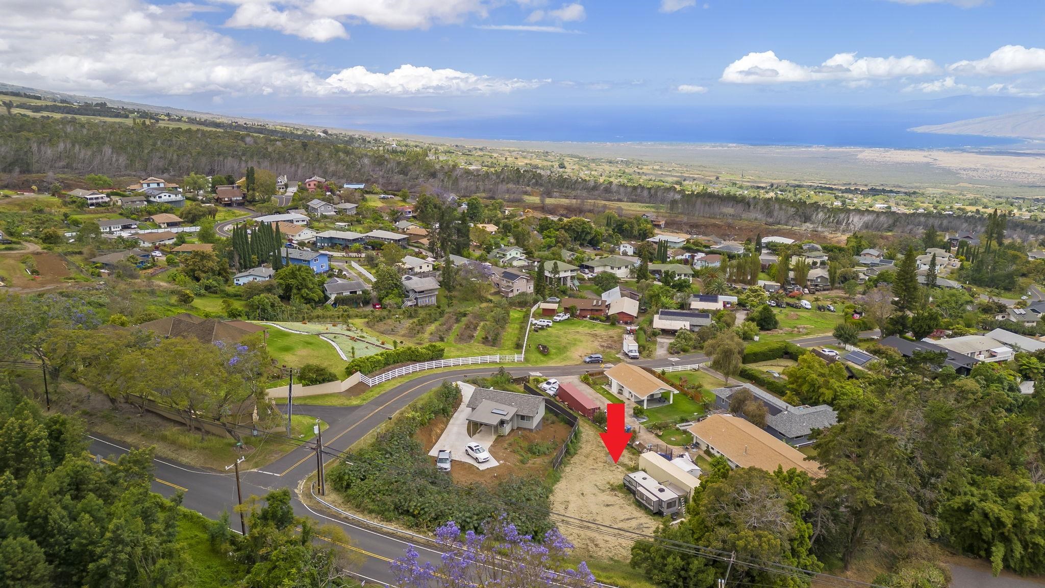 an aerial view of residential houses with outdoor space and street view