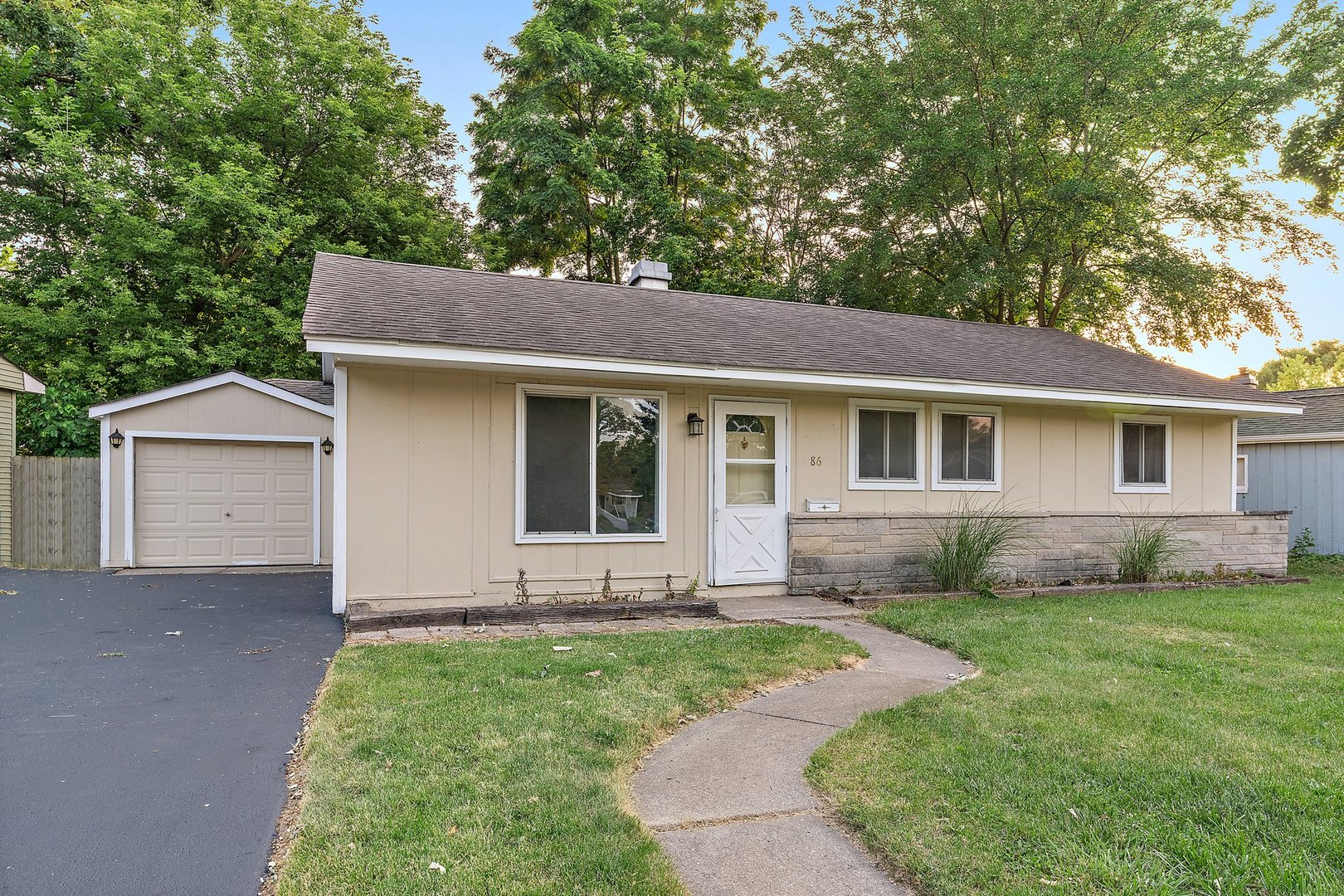 front view of a house with a yard