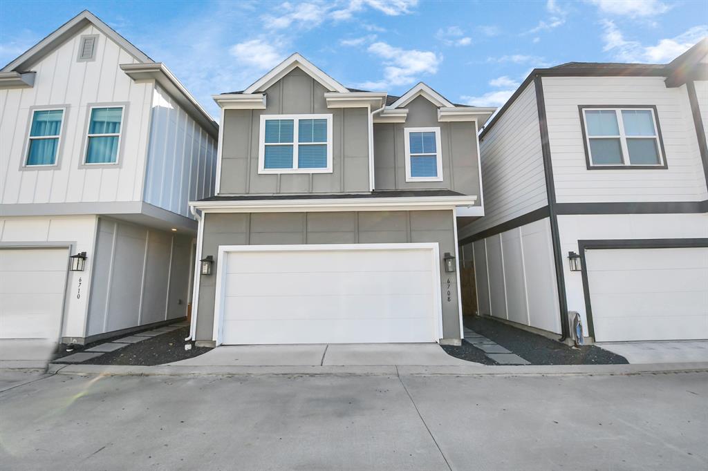 a front view of a house with a garage