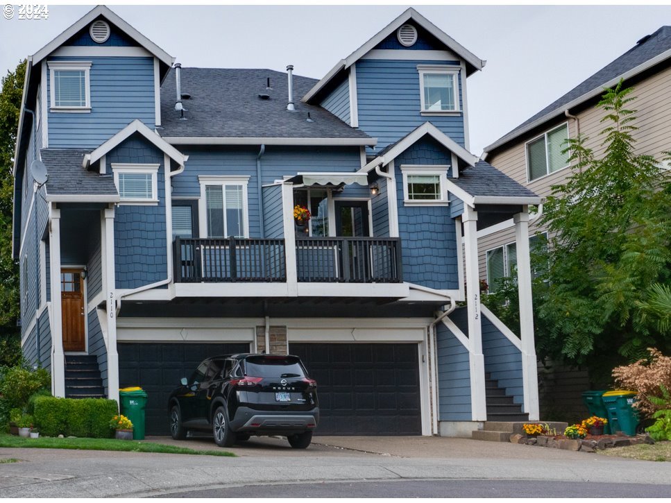 a front view of a house with garage