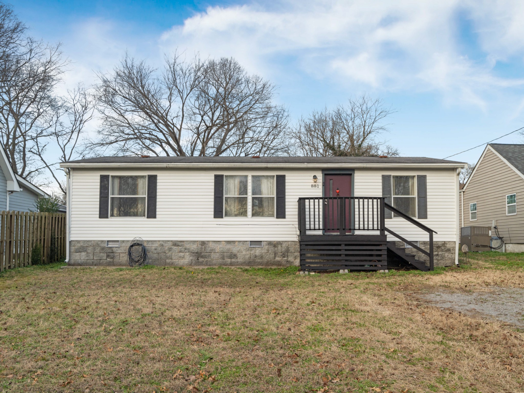 a front view of a house with a yard