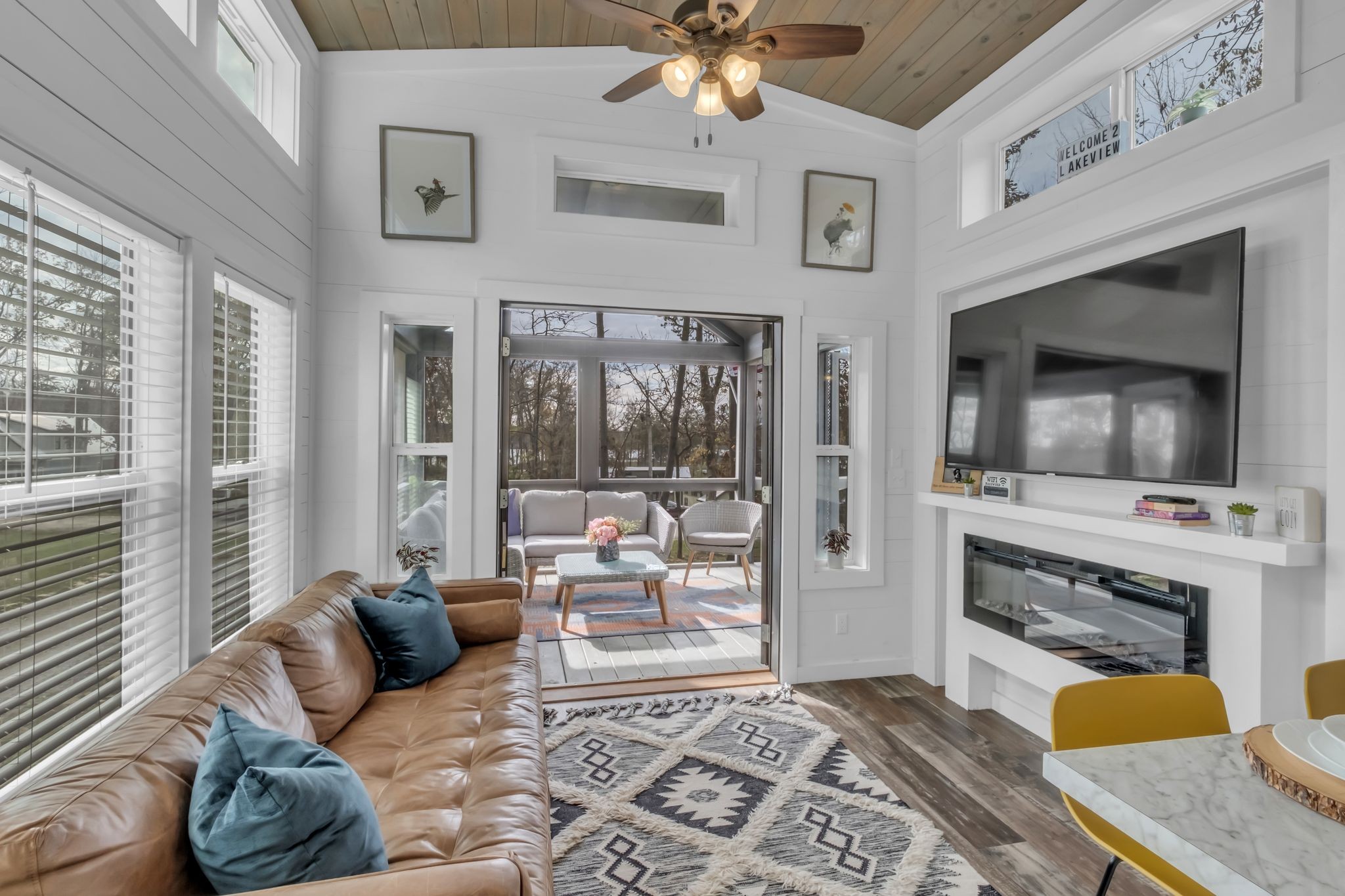 a living room with furniture fireplace and flat screen tv