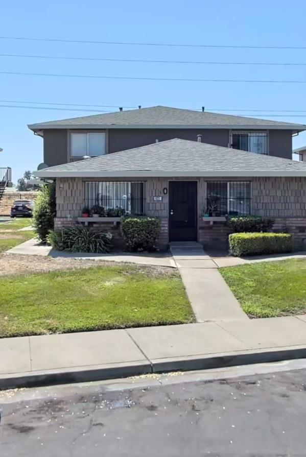 a front view of a house with a yard