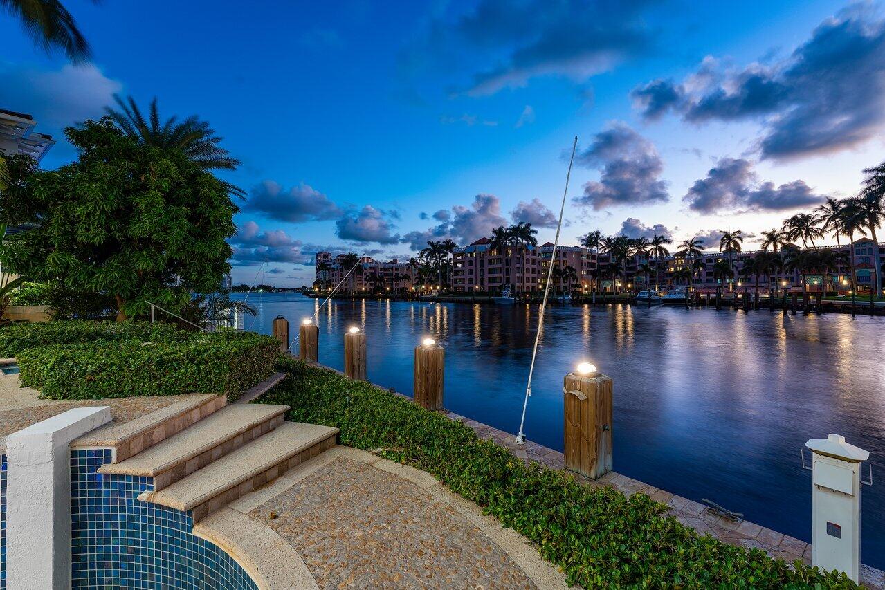 a view of a lake with houses in the back