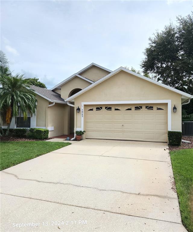 a view of garage and yard