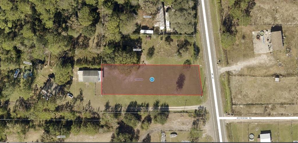 an aerial view of residential house with outdoor space and lake view