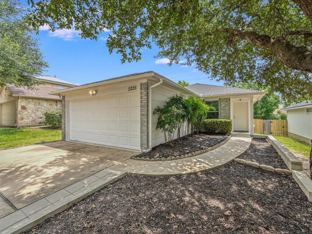 Just beautiful!  Welcome home!  Low maintenance manicured landscaping and great curb appeal!