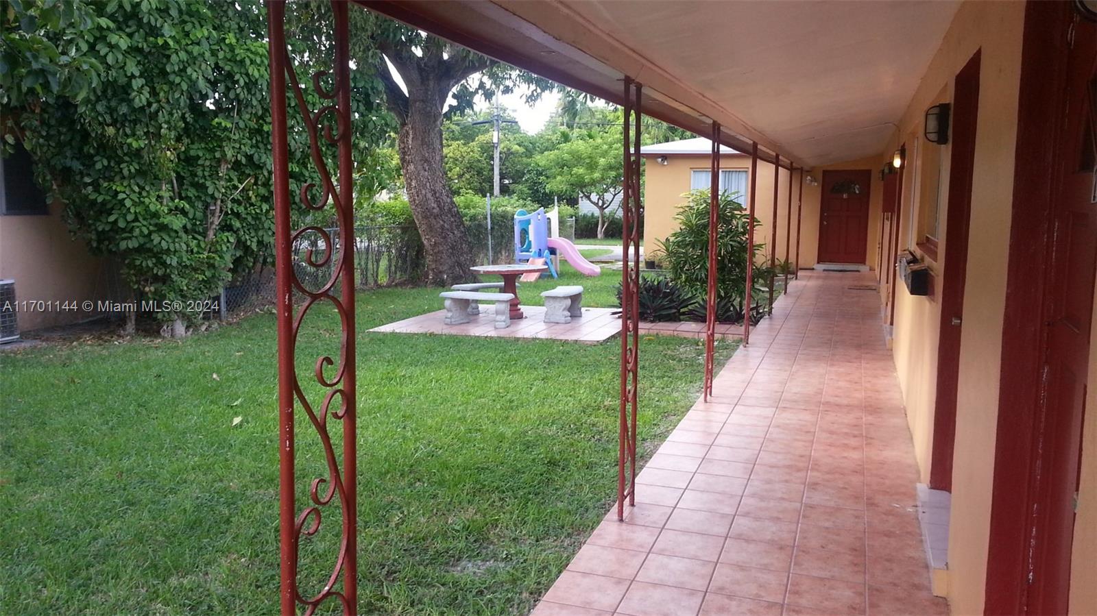 a view of a patio with a garden