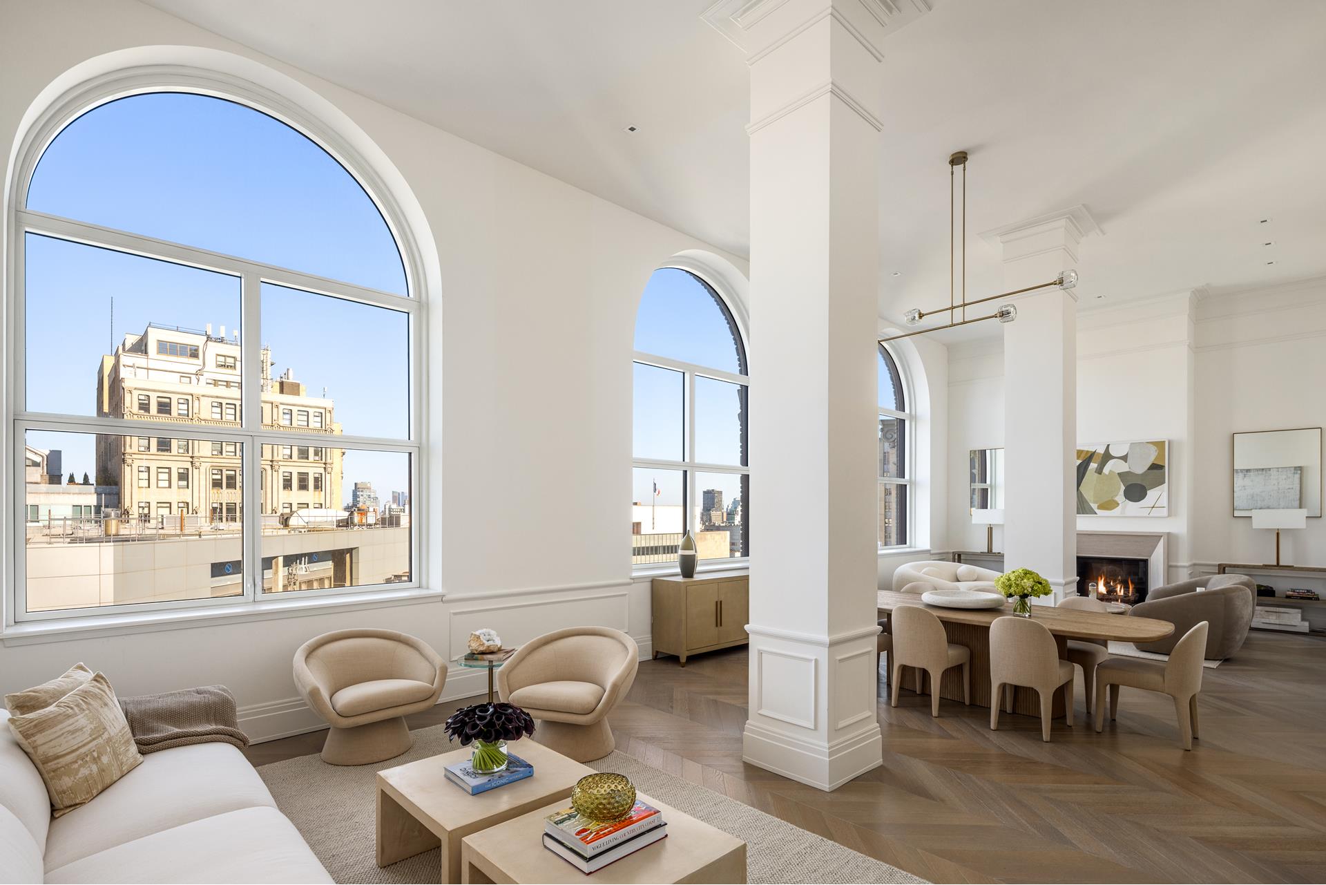 a living room with furniture a table and a large window