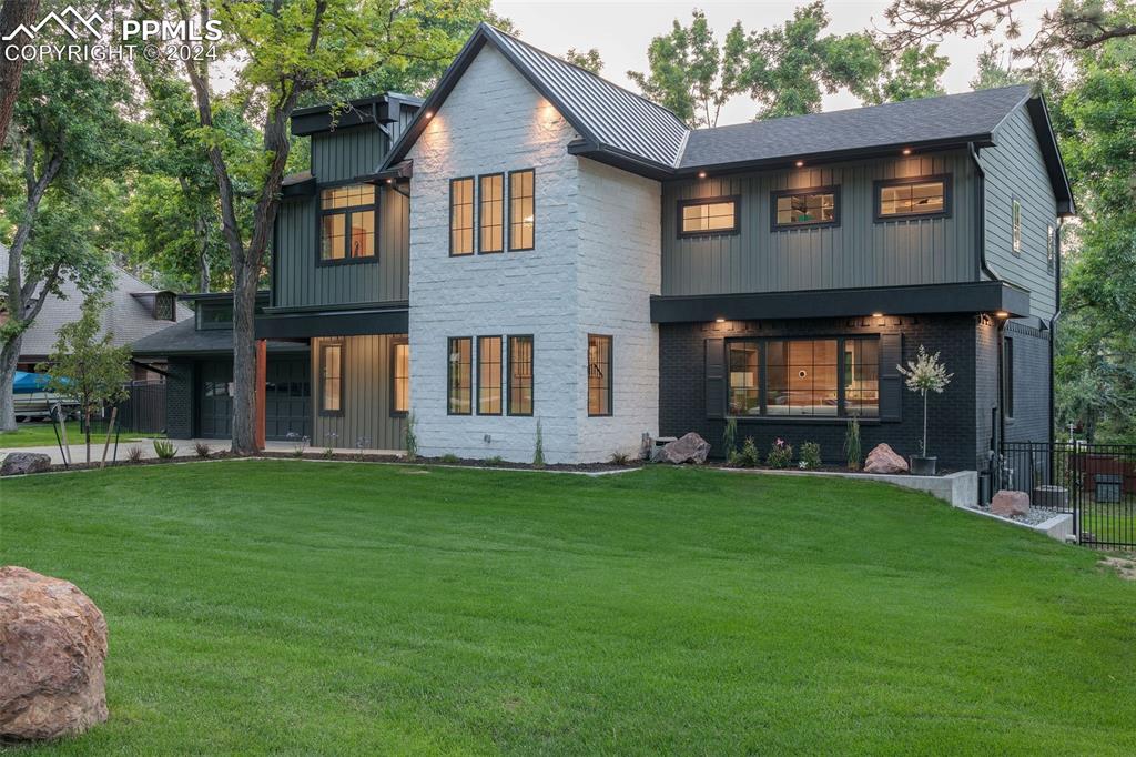 a front view of a house with a garden