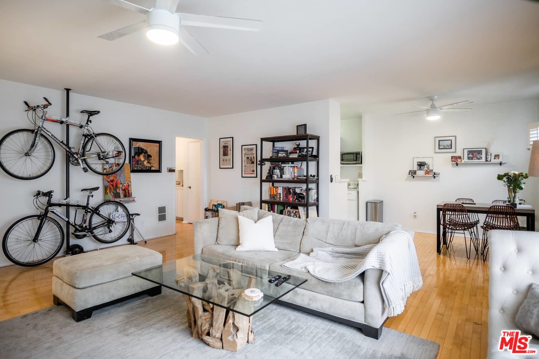 a living room with furniture and gym equipment