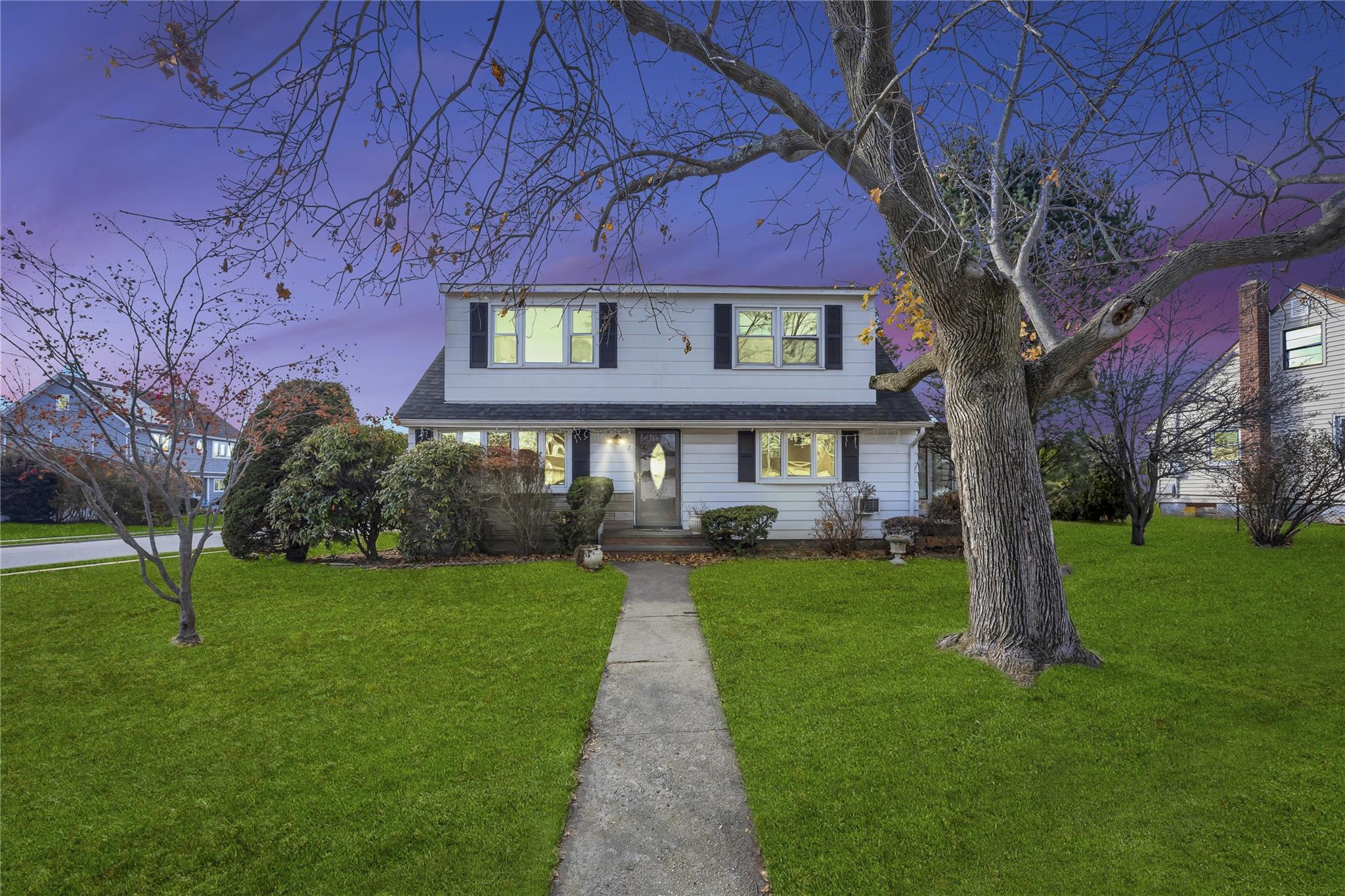 a front view of a house with a yard